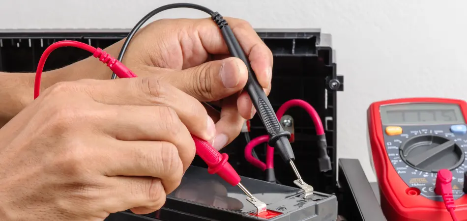 A man tests a UPS battery
