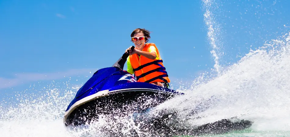 A jet ski rides the waves